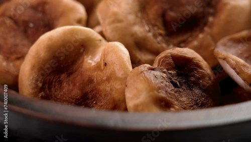 Raw shiitake mushrooms in wooden bowl close up. Healthy organic food. Rotation. Lentinula edodes photo