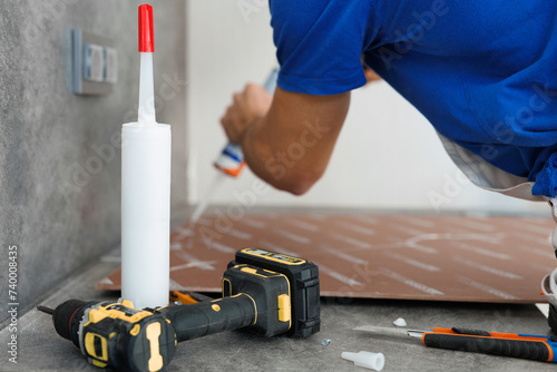Fotografía Close-up of gluing a wall panel onto a wall