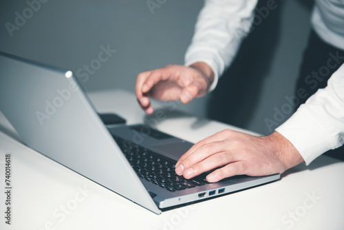 man using laptop computer on white background