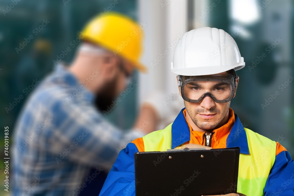 inspector engineer inspecting construction new house. inspector engineer inspecting construction new house.