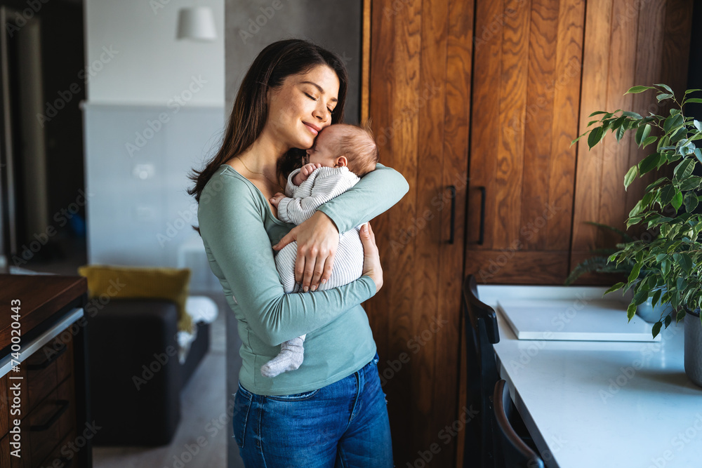 Loving mother carying of her newborn baby at home. Family parenting baby single mother love concept. Loving mother carying of her newborn baby at home. Family parenting baby single mother love concept.