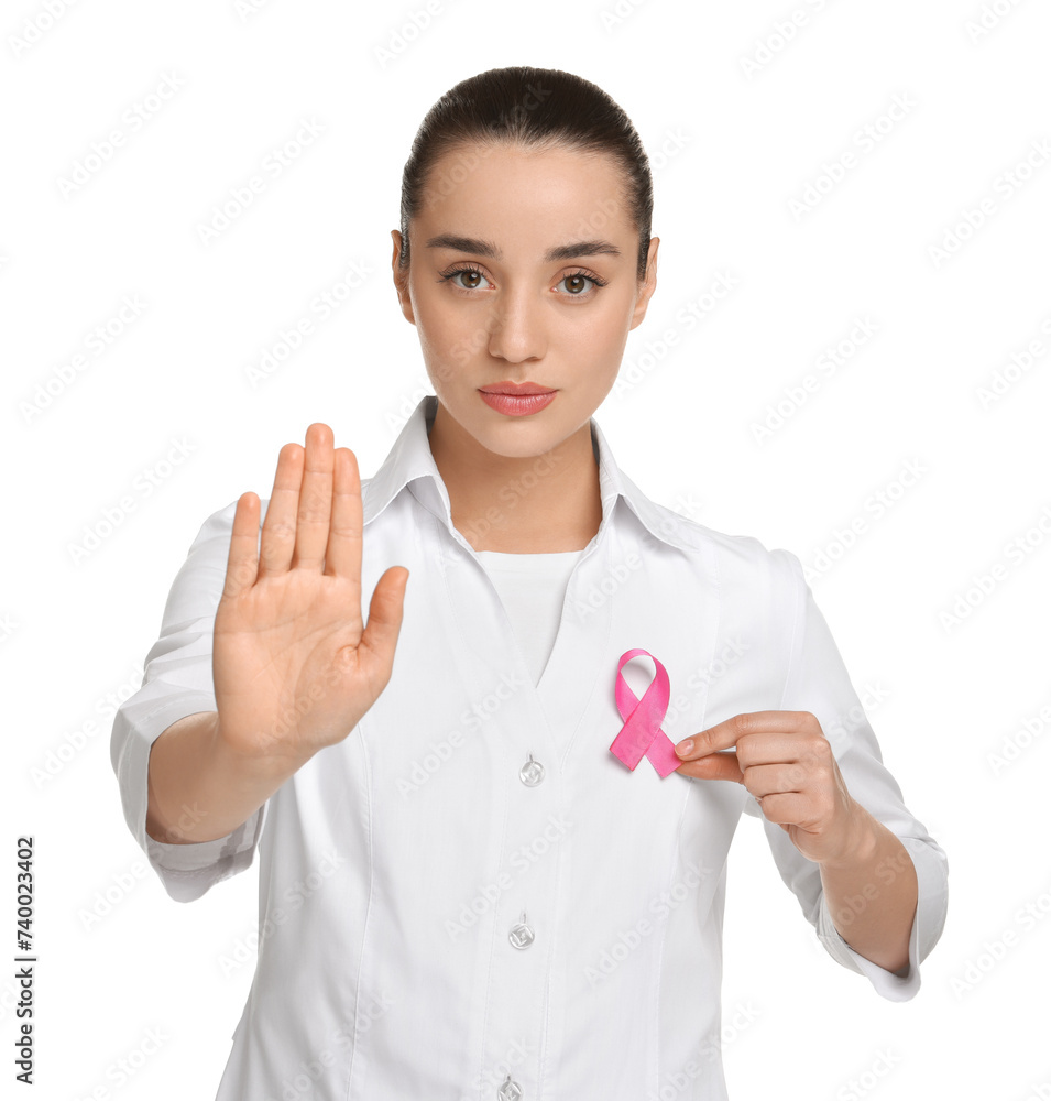 Mammologist with pink ribbon showing stop gesture on white background. Breast cancer awareness Mammologist with pink ribbon showing stop gesture on white background. Breast cancer awareness