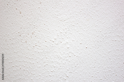 Authentic white plastered wall, background, texture. Gray and white plaster.