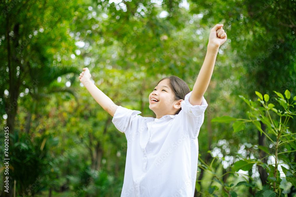 Asian woman breathing clean air in nature forest. Happy girl open arms in happiness. Fresh outdoor woods, wellness healthy lifestyle concept. Asian woman breathing clean air in nature forest. Happy girl open arms in happiness. Fresh outdoor woods, wellness healthy lifestyle concept.
