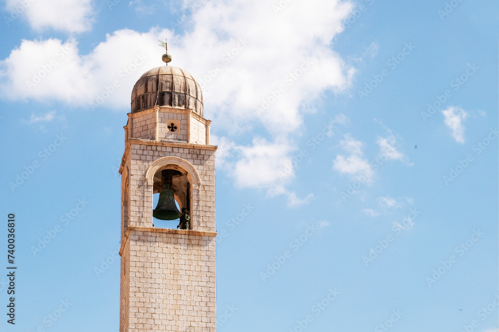 old tower with a bell and a clock in Dubrovnik in Croatia. Travel around Europe