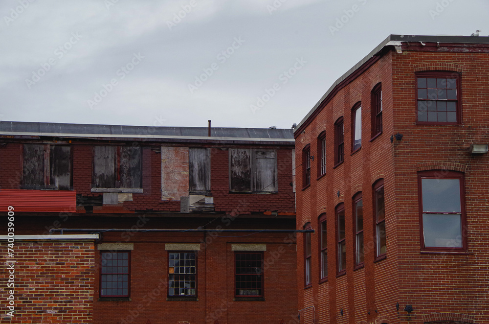 Romantic backstreet, side street or alley in historic old town of Portland, Maine with New England style architecture facades, a landmark sightseeing tourist spot in downtown