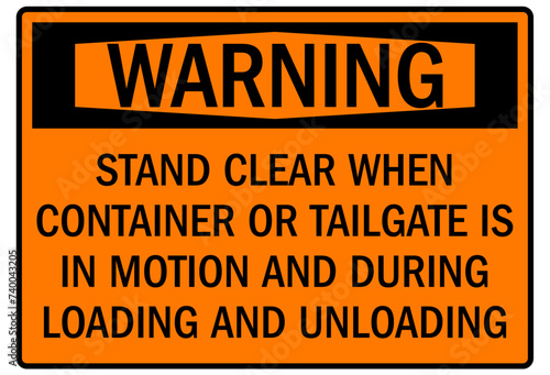 Truck safety sign stand clear when container or tailgate is in motion and during loading and unloading