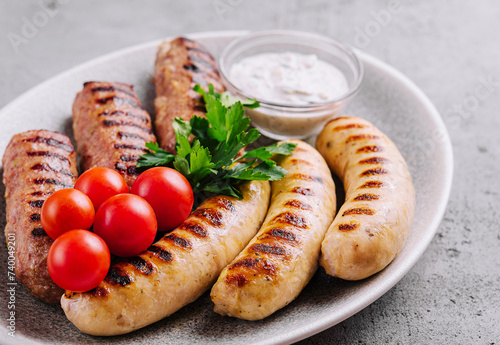 fried sausages with tomatoes cherry on plate