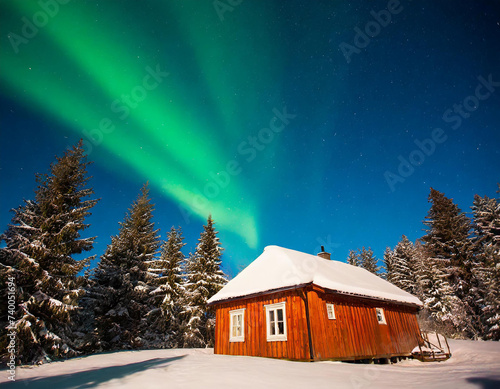 Vibrant Nordic Cabin Winter Wonderland and Northern Lights © luis