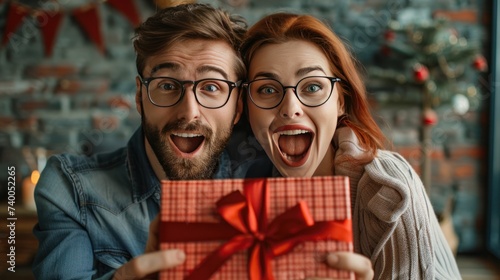 Excited Couple with Christmas Gift