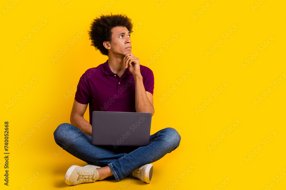 Photo of minded uncertain unsure man wear stylish violet clothes hand touch chin look up empty space isolated on yellow color background Photo of minded uncertain unsure man wear stylish violet clothes hand touch chin look up empty space isolated on yellow color background