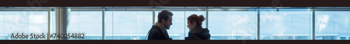 Long narrow banner for travelling theme. 8:1. Couple taking in the airport. Blue