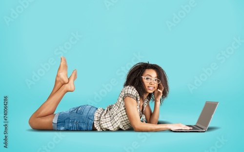 Photo of funny teen girl study with laptop © BillionPhotos.com