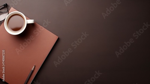 Office leather business desk table with coffee cup, notepad and pen. Top view with copy space