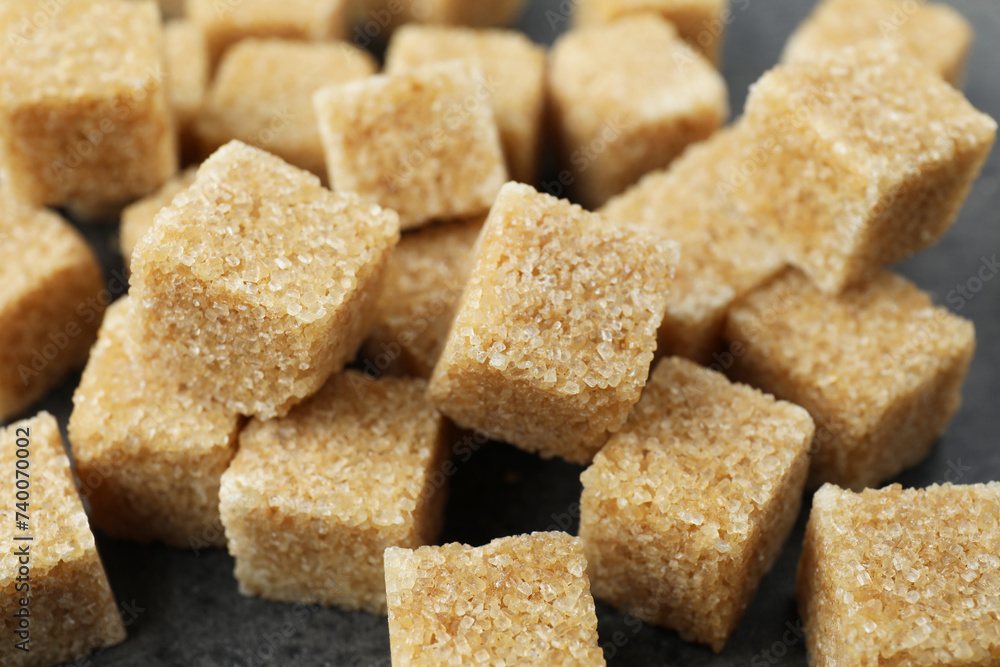 Brown sugar cubes on table, closeup view Brown sugar cubes on table, closeup view