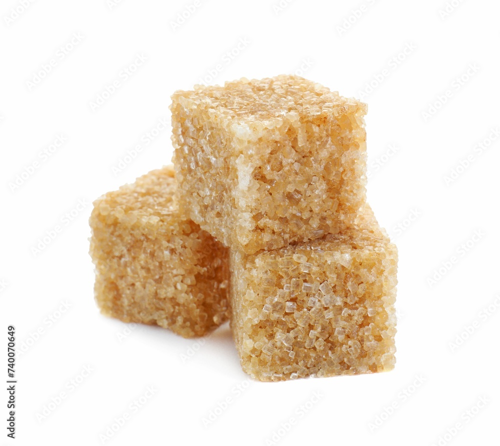 Three brown sugar cubes isolated on white Three brown sugar cubes isolated on white