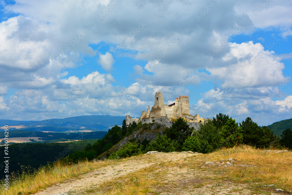 ruiny zamku na górze, castle, ruins of a castle on a hill against the blue sky	 - obrazy, fototapety, plakaty 