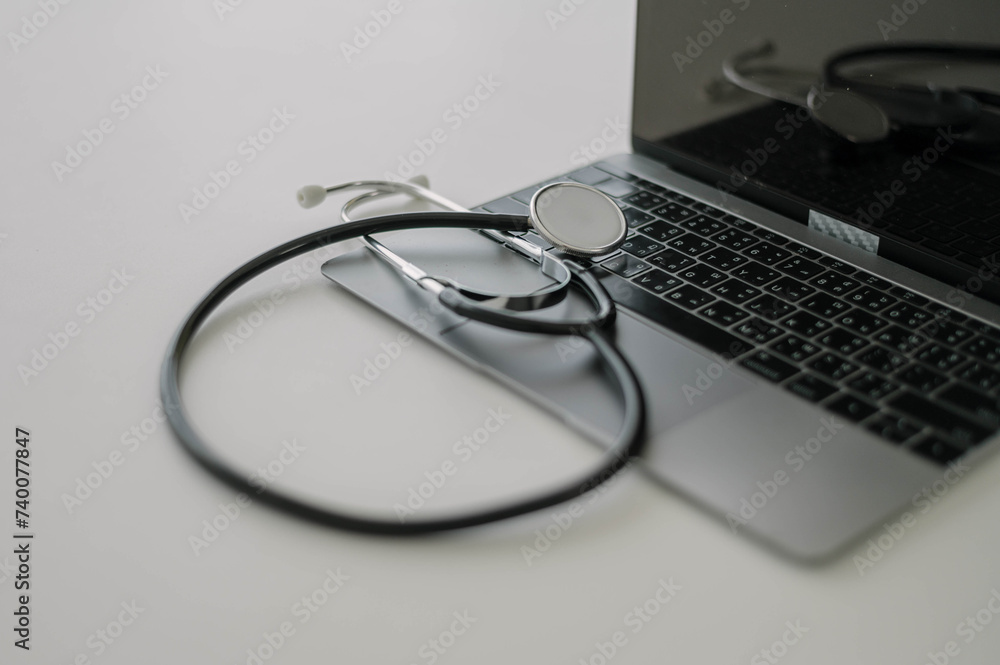 Stethoscope on Laptop - Telemedicine Concept Stethoscope on Laptop - Telemedicine Concept
