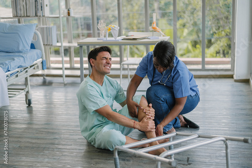 Professional physiotherapist hand support young man in rehabilitation physical center. African female doctor treating muscle and joint injuries to male in hospital. Orthopedic concept.