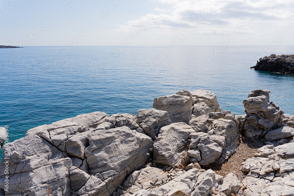 Beautiful view of the sea from the top of a cliff with rocks on the Greek island of Crete early summer