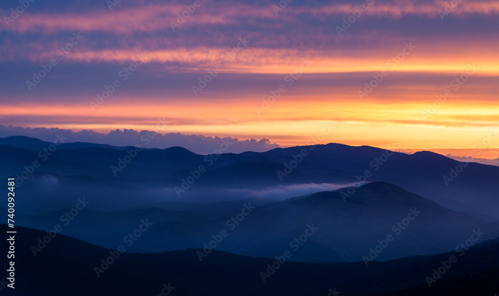 Landscape. Sunset over the mountains with clouds Landscape. Sunset over the mountains with clouds