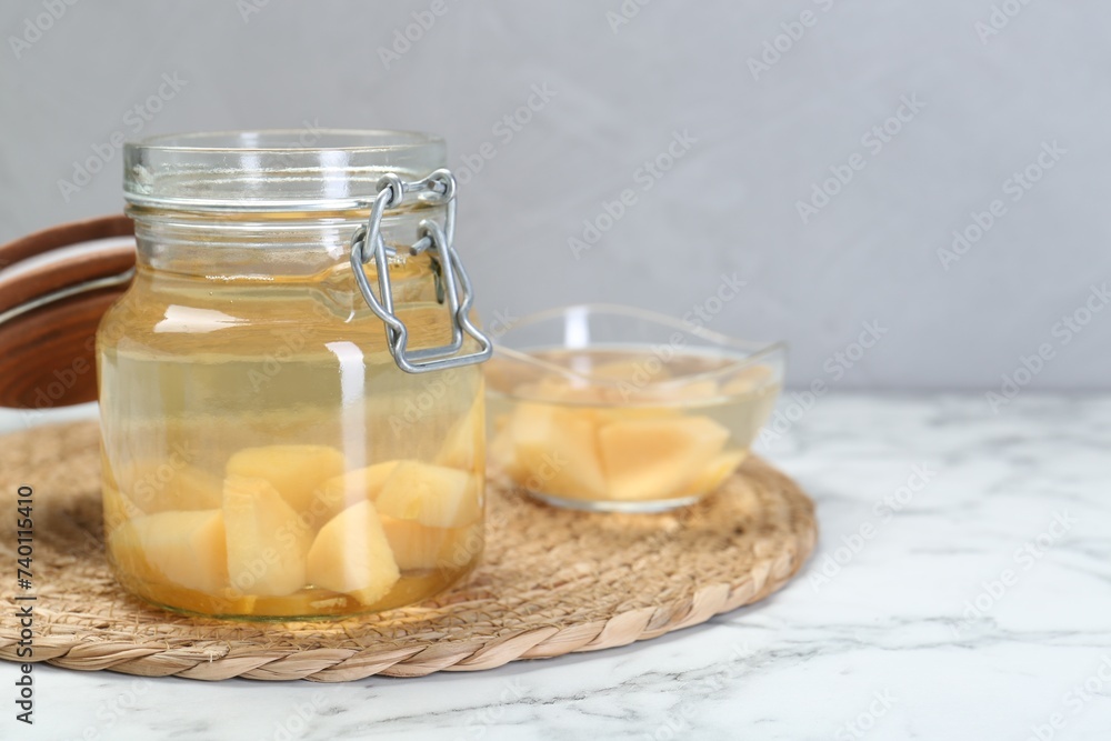 Delicious quince drink on white marble table. Space for text Delicious quince drink on white marble table. Space for text