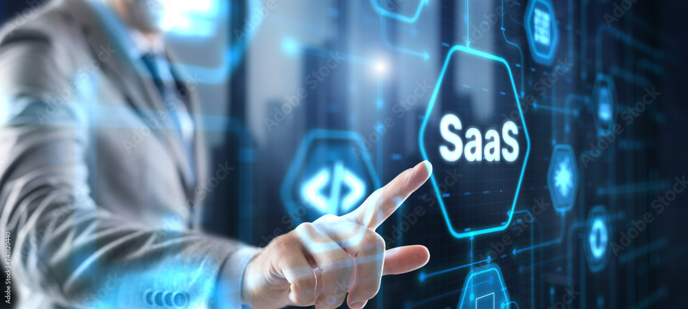 SaaS software as a service concept with hand pressing a button SaaS software as a service concept with hand pressing a button