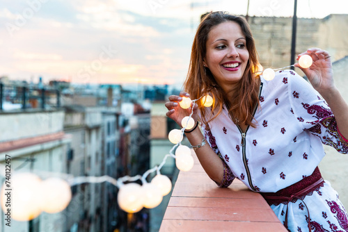Happy smiling woman portrait on a rooftop in Barcelona
