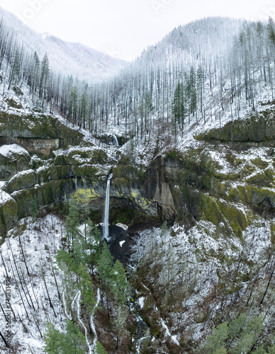 The Elowah waterfall flows over rugged, mountainous landscape in the Columbia River Gorge separating the states of Oregon and Washington. The Pacific Northwest region has incredible outdoor scenery. photo