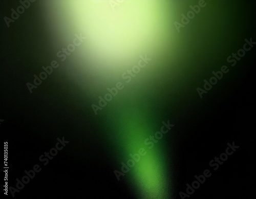 Glowing green blurred light gradient dark grainy black vertical background glowing light spot copy space © FREDCassandra