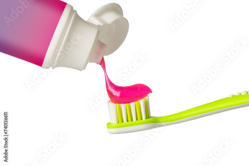 Applying pink paste on toothbrush