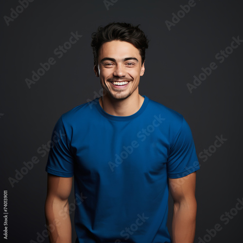 Smiling men wearing blue T-Shirt Mockup on black studio background