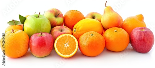 A mix of oranges, apples, pears, and orange slices piled together, isolated on a white background.