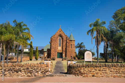 The Neo-Gothic Saint Mary’s Catholic Church (Our Lady of Ara Coeli), constructed of rough hammer-dressed red sandstone, in Northampton, Western Australia
 photo
