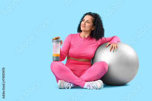 Sporty adult woman with fit...