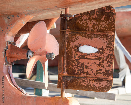 A zinc sacrificial anode on a marine vessel. The anode will dissolve protecting the iron from corrosion. photo