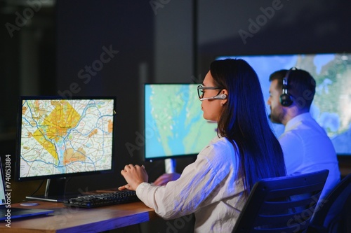 Diverse call center operators team use computers consulting clients in office