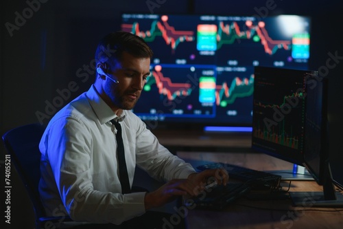 Crypto trader investor analyst looking at computer screen analyzing financial