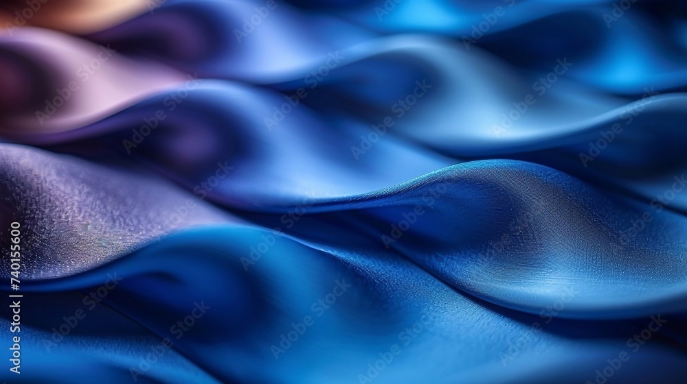 Fototapeta premium Background, waves of silk, satin fabric in blue color