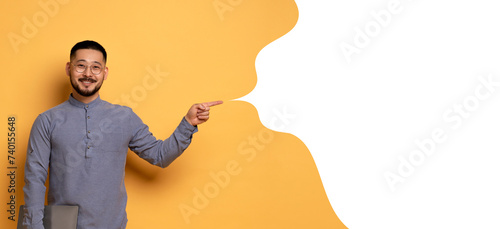Asian man holds laptop pointing to empty speech bubble , collage