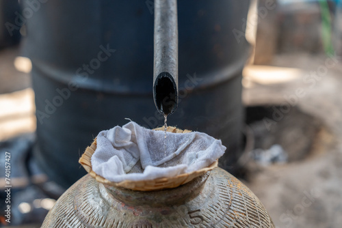 Distillation of Laos Whisky in a village near Luang Prabang, Laos, South-East Asia