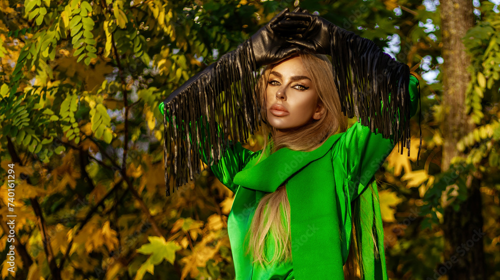 Spring, summer fashion. Glamour, stylish elegant woman in colorful dress and coat in the city. Casual, urban style. Vogue. Spring, summer fashion. Glamour, stylish elegant woman in colorful dress and coat in the city. Casual, urban style. Vogue.
