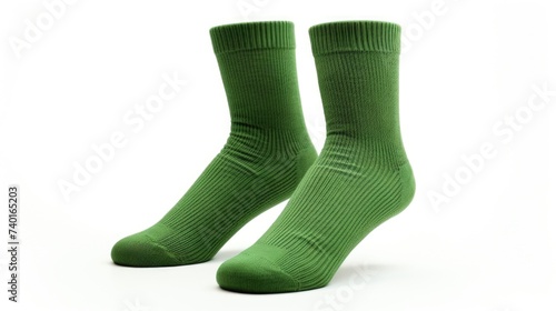 A pair of green socks on a plain white background. Suitable for fashion or clothing concepts