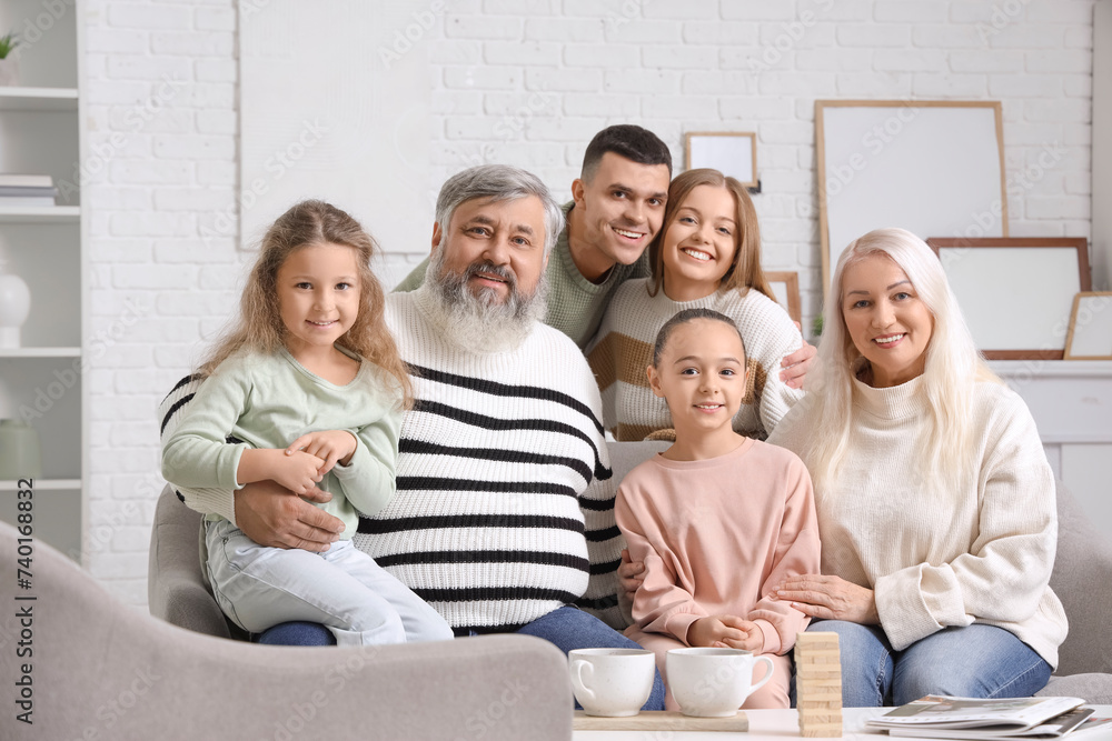 Big family sitting on sofa at home Big family sitting on sofa at home