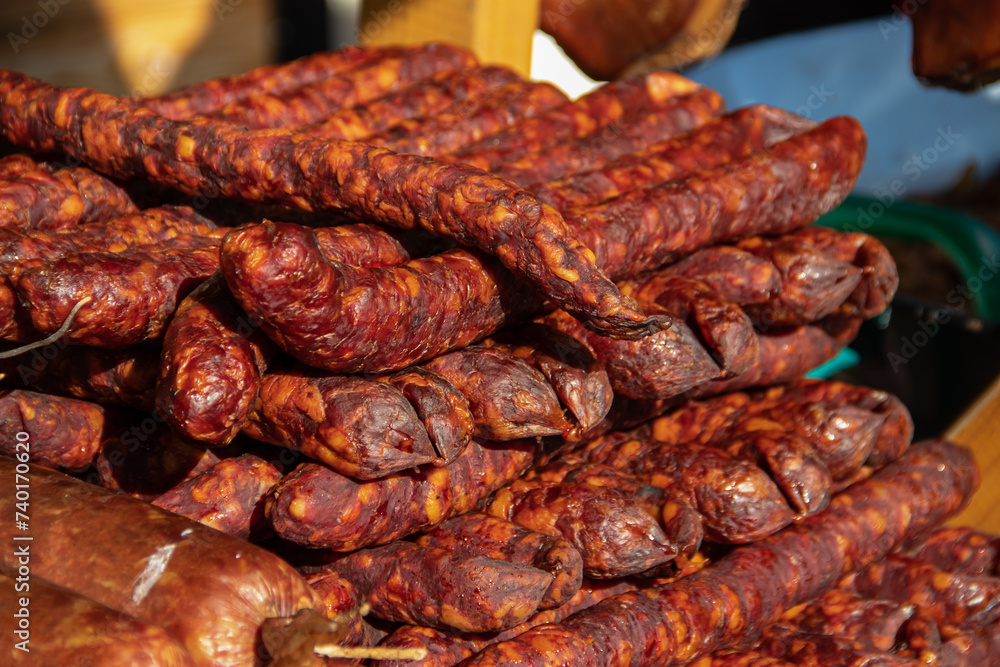 Serbian traditionally made and smoke dried sausages on a farmer's market in Kacarevo village, gastro bacon and dry meat products festival held yearly in Kacarevo, near Belgrade Serbian traditionally made and smoke dried sausages on a farmer's market in Kacarevo village, gastro bacon and dry meat products festival held yearly in Kacarevo, near Belgrade