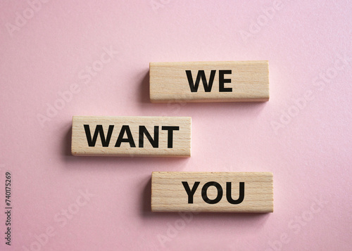 We want you symbol. Concept words We want you on wooden blocks. Beautiful pink background. Business and We want you concept. Copy space.