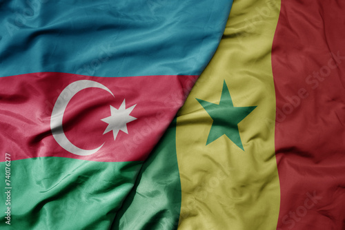 big waving national colorful flag of senegal and national flag of azerbaijan.