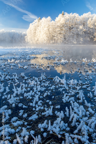frosty sunrise at the spring water lake
