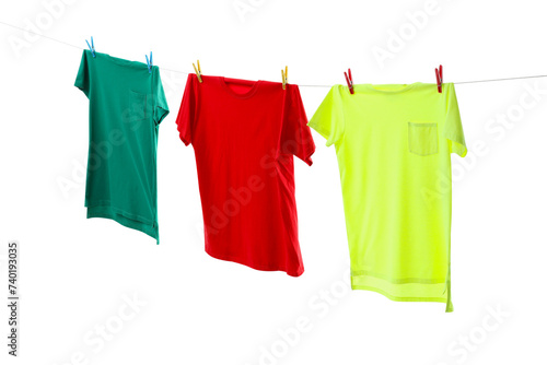 Colorful t-shirts drying on washing line isolated on white