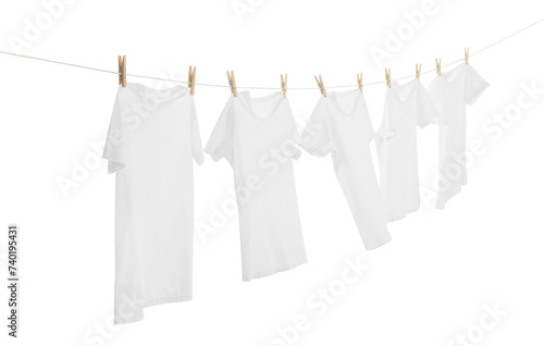 Many t-shirts drying on washing line isolated on white